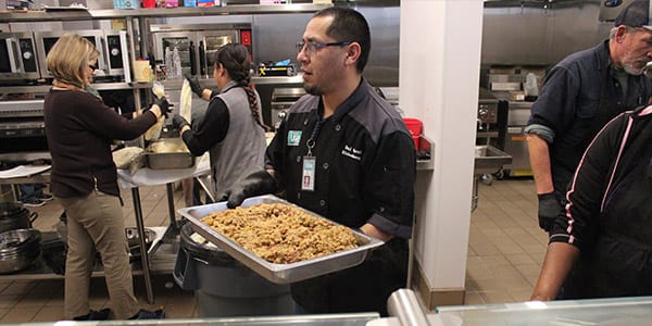 volunteers working in the kitchen at TCUGM