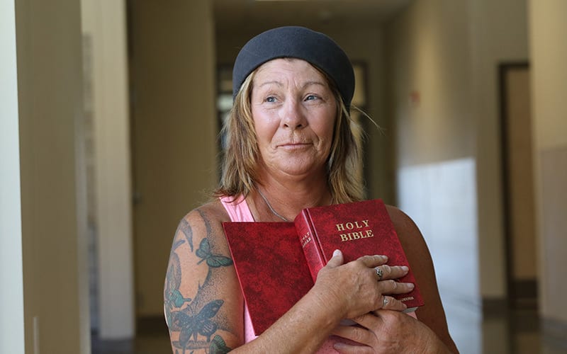 woman holding a Bible